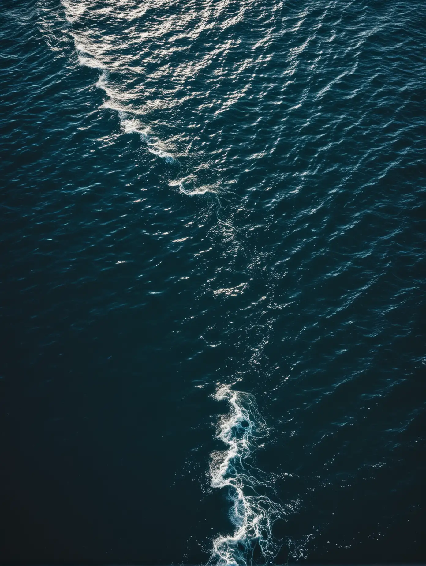 Aerial View of Deep Blue Ocean Waves