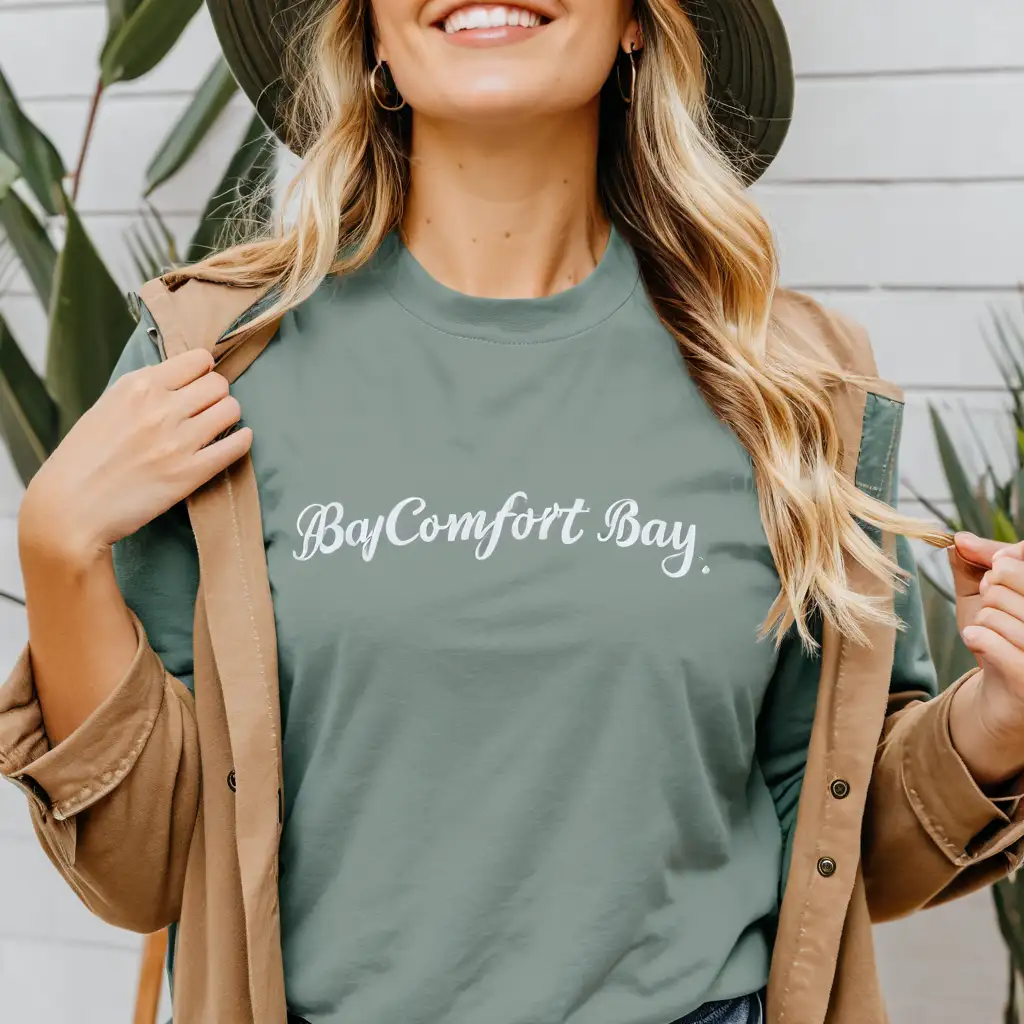 blonde wavy hair woman wearing comfort colors bay t-shirt mockup, jacket and hat, simple boho background, good visible stiches