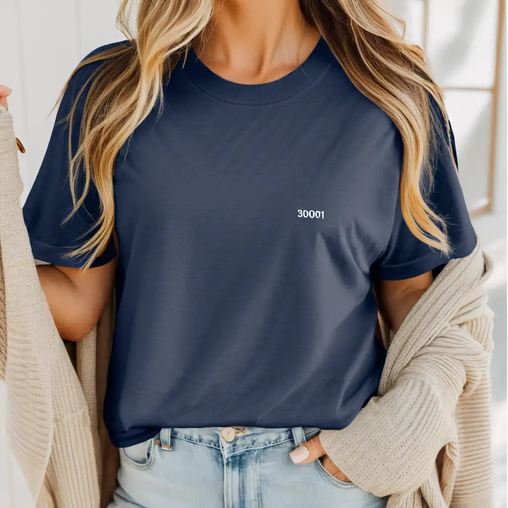 petite blonde woman wearing bella canvas 3001 navy blue oversized t-shirt mockup, with cream cardigan, simple boho home background, clear stiches