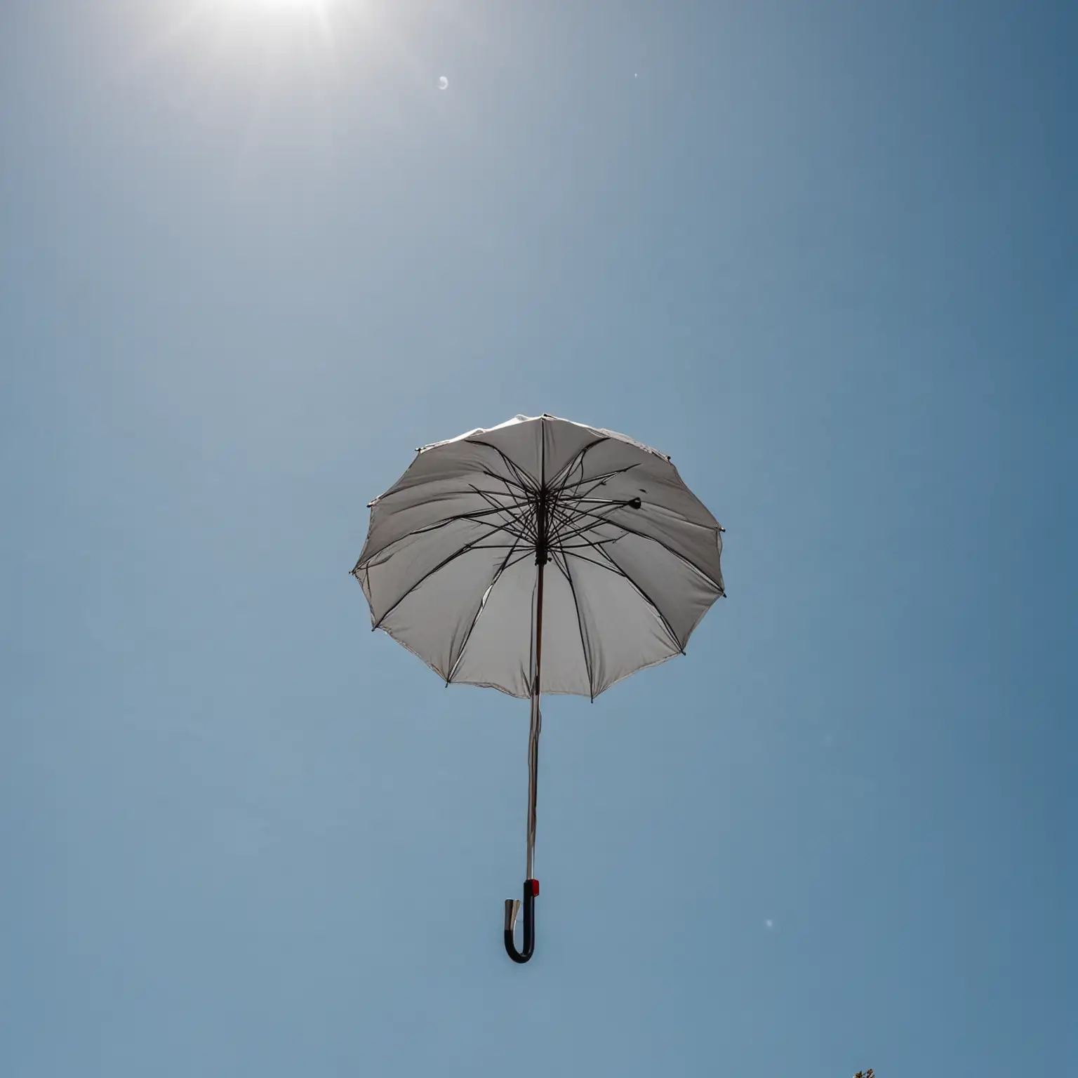 Umbrella Floating in Clear Blue Sky