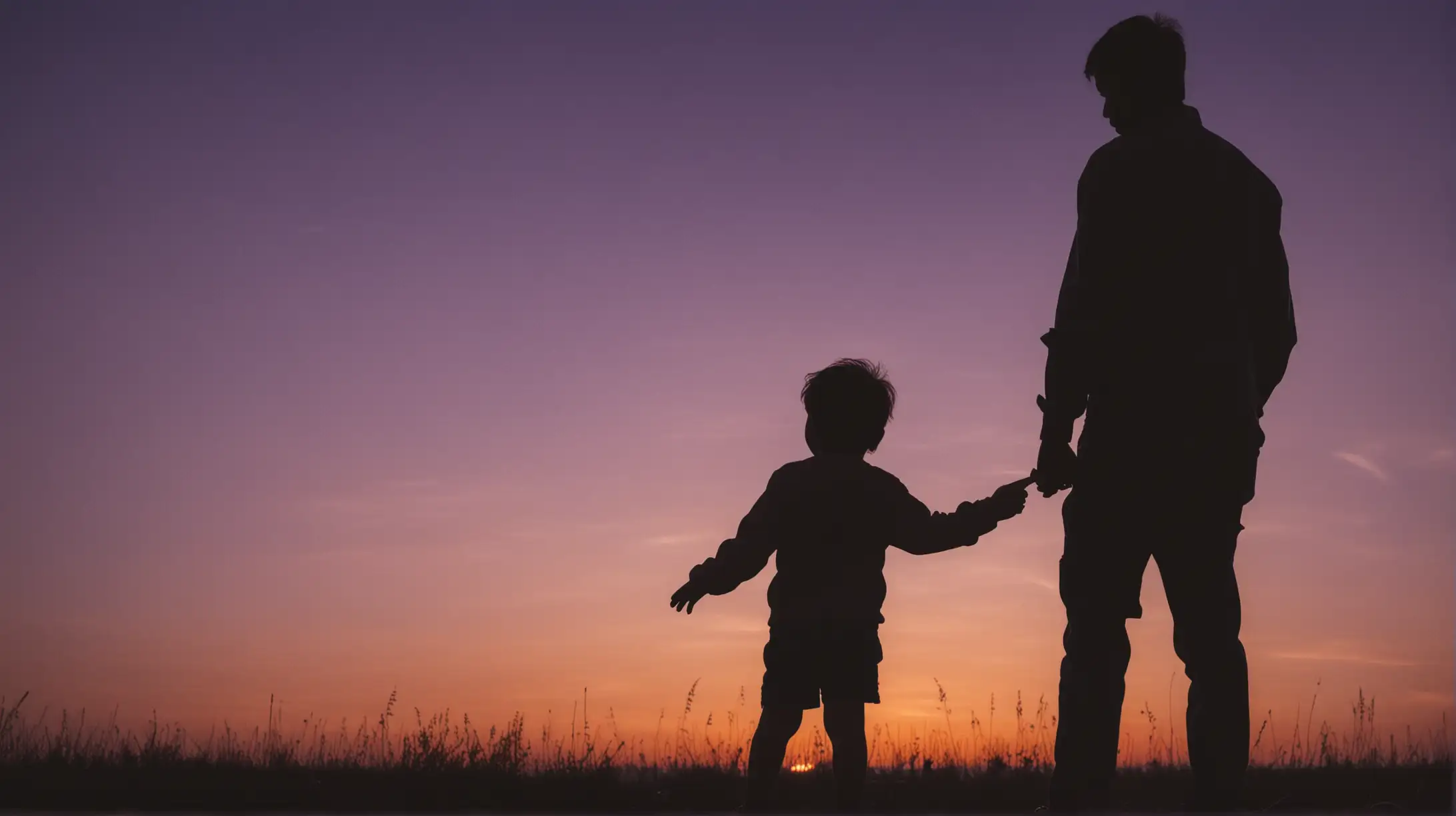 silhouette of a child with his father against the backdrop of twilight