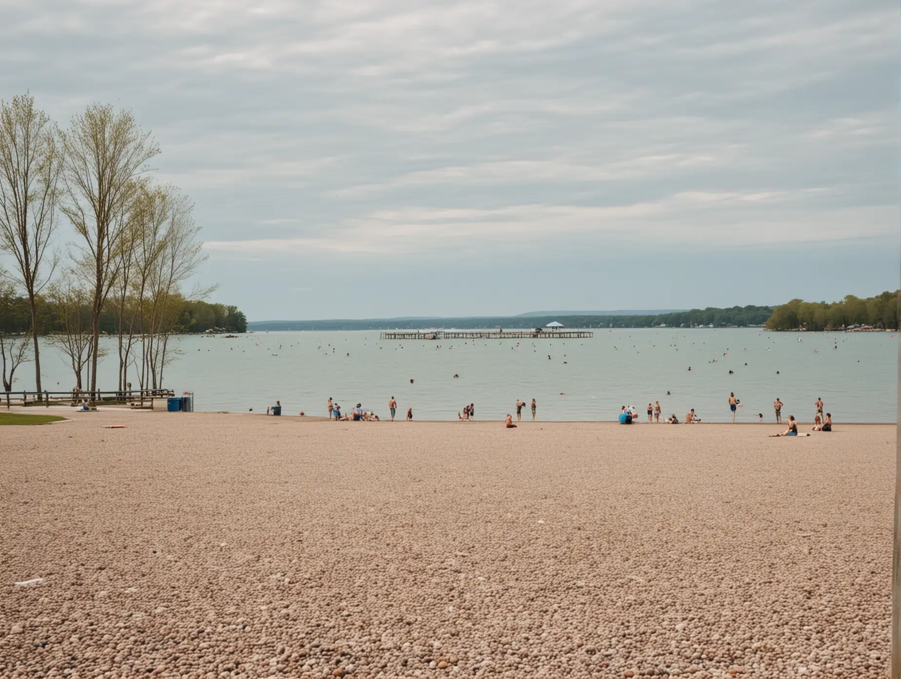 lakefront scene gravel parking lot in front people swimming in water in background