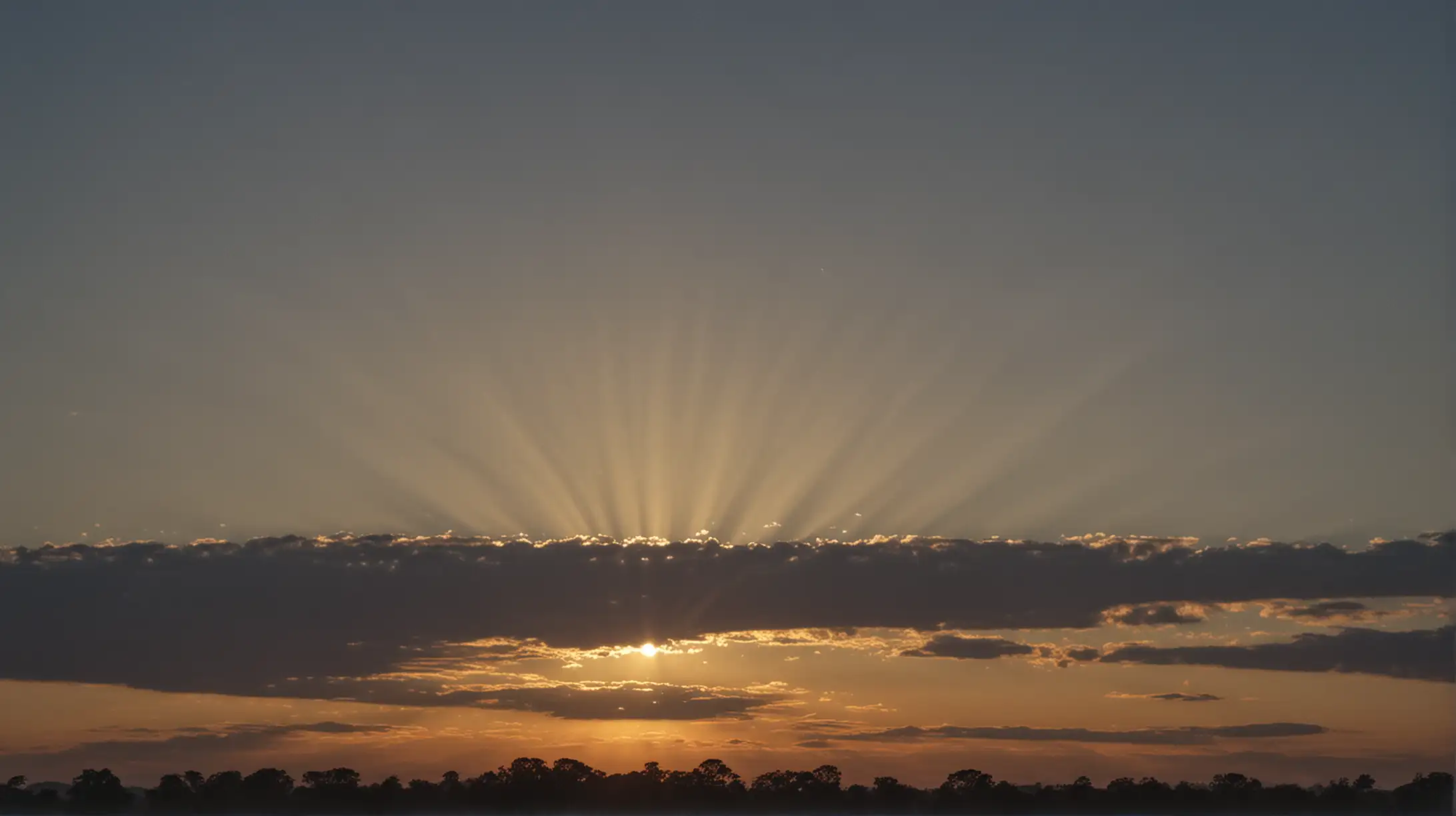 faint but bright sunburst over the horizon early morning dawn

