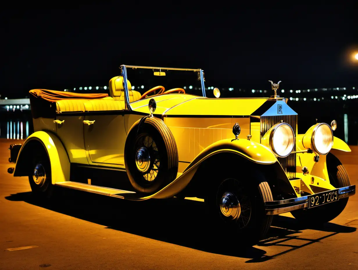 A yellow 1920s Rolls Royce at night